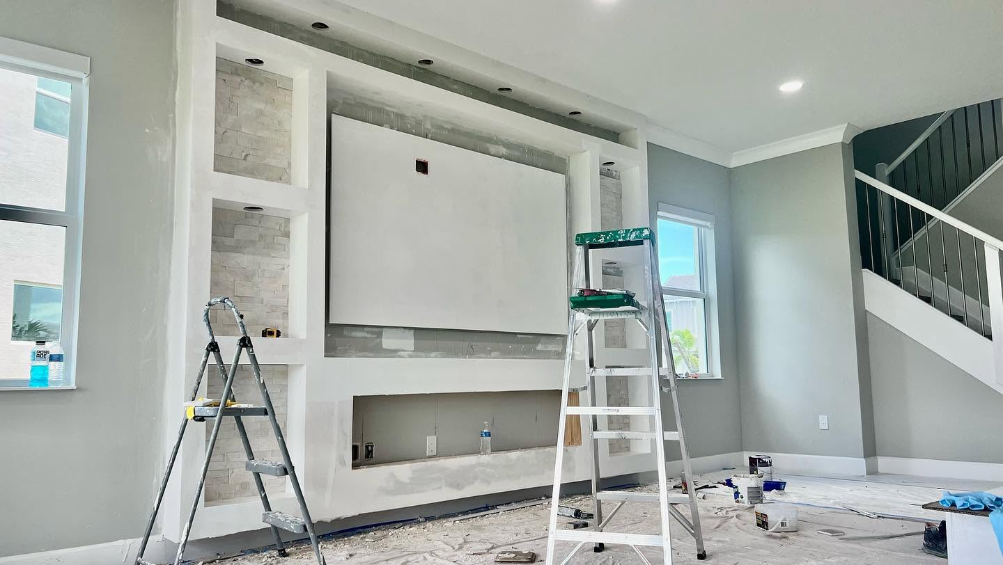 The feature wall during construction, framed and skimmed with ladders still in the room.